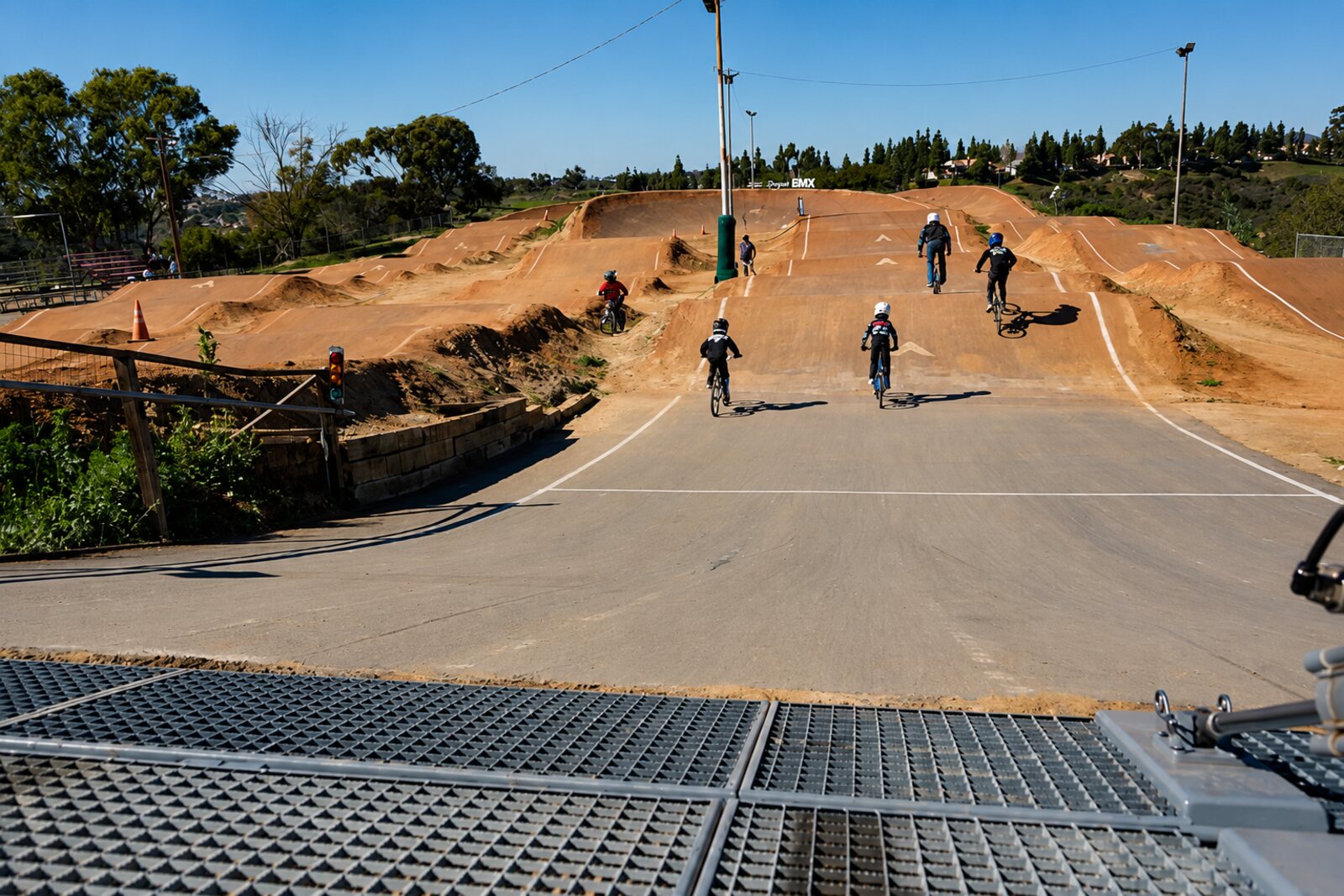Riders rolling out of the start gate at the San Diego BMX track in Kearny Mesa
